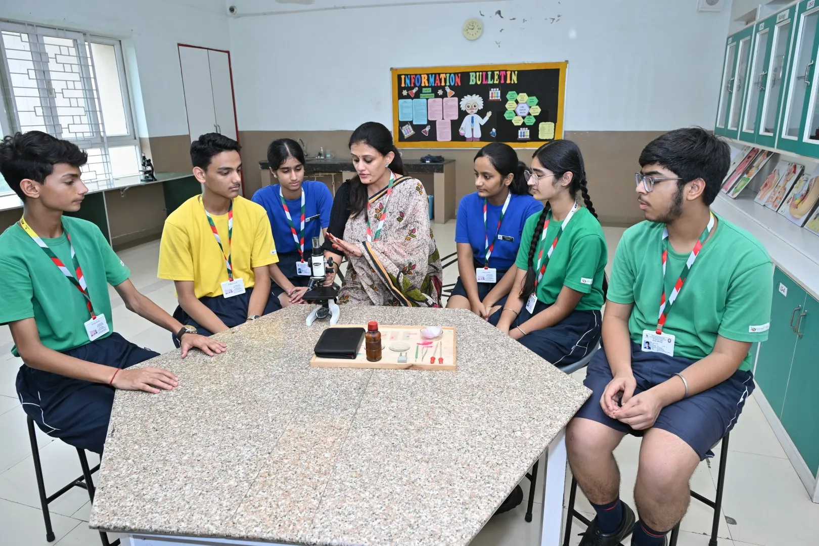 Students engaged in a practical science learning activity