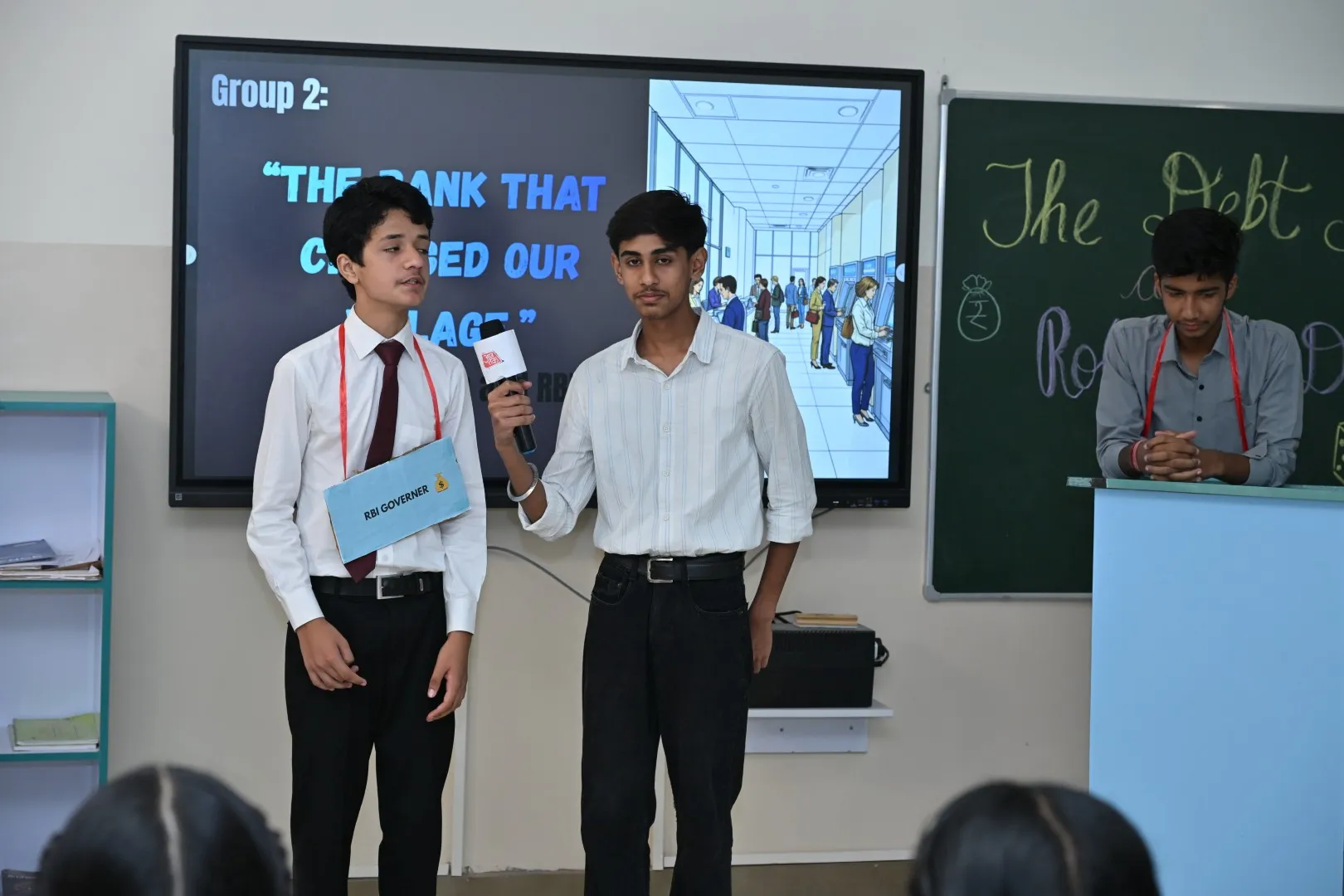 Students presenting ideas to an audience