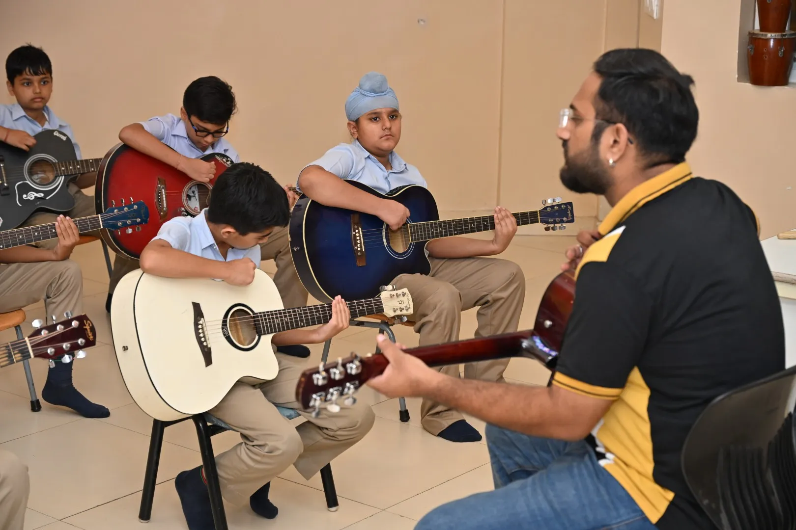 Students participating in music activities at ATS Valley School