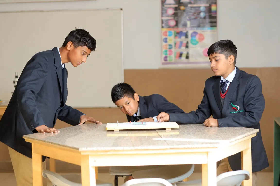 Students working together on a practical technology activity